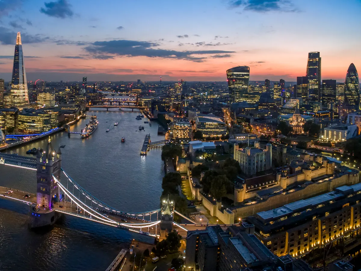 London: the Thames, Tower Bridge and the City skyline at dusk