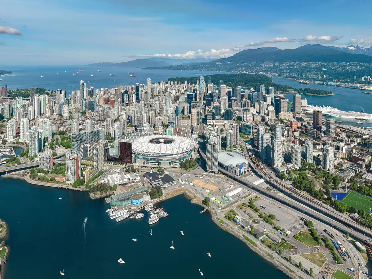 Vancouver: aerial view of downtown, False Creek and the North Shore mountains